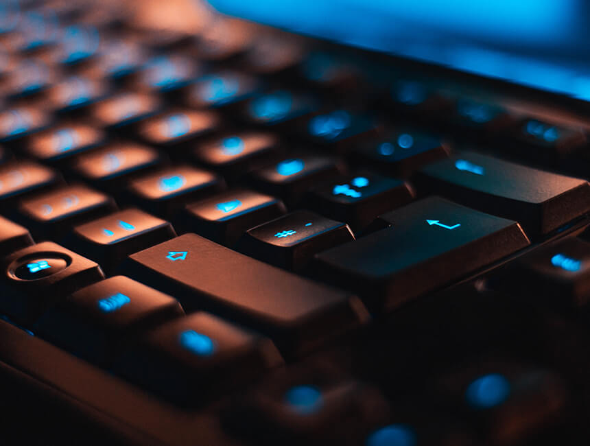 A Team Using a Laptop With Black Keyboard